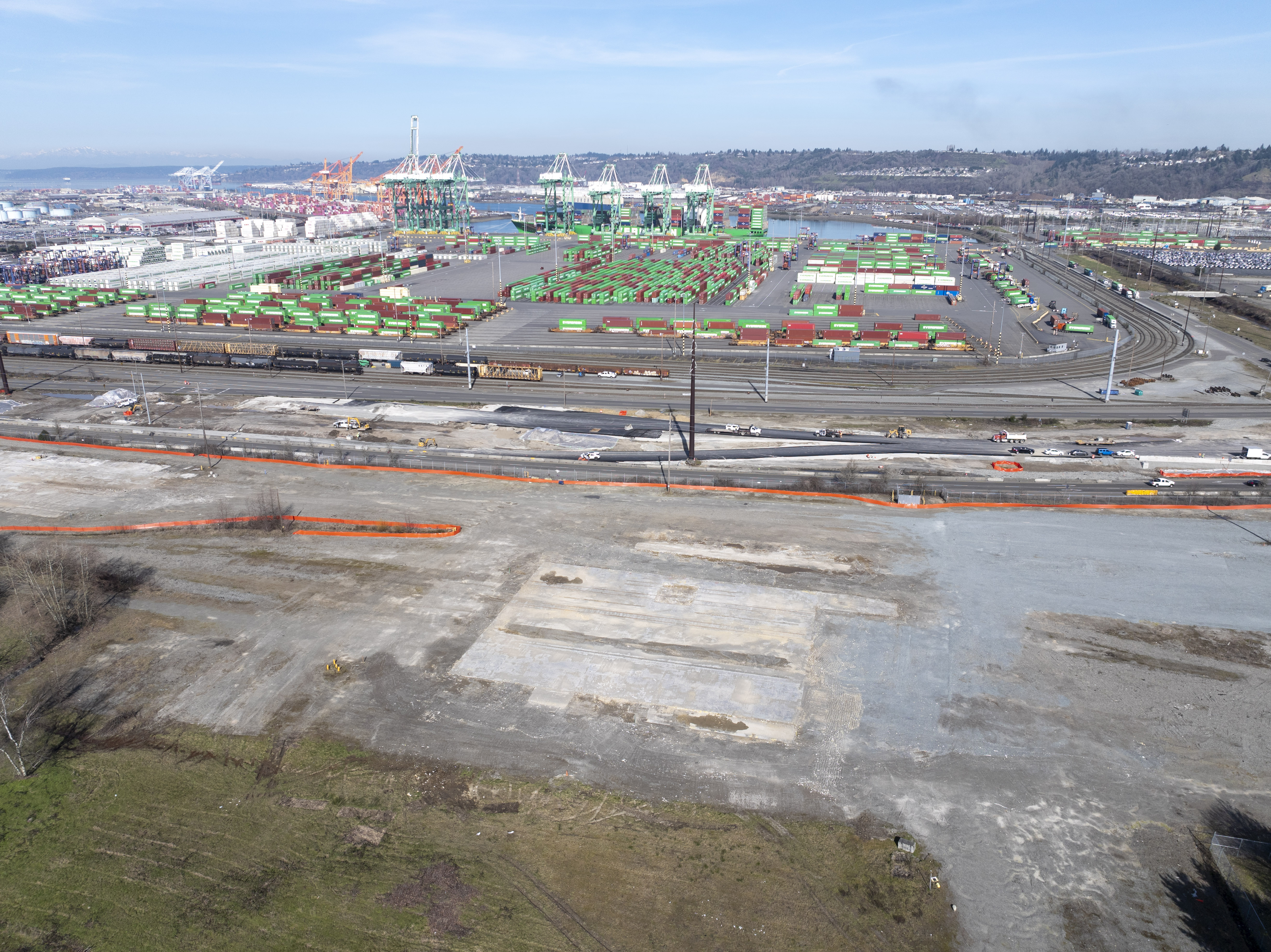 Aerial photo of vacant land near a Port terminal on a sunny day.