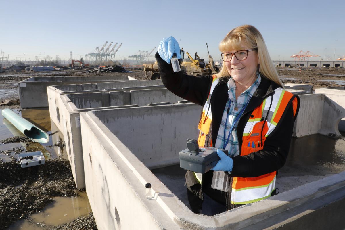 photo of a woman holding water sample