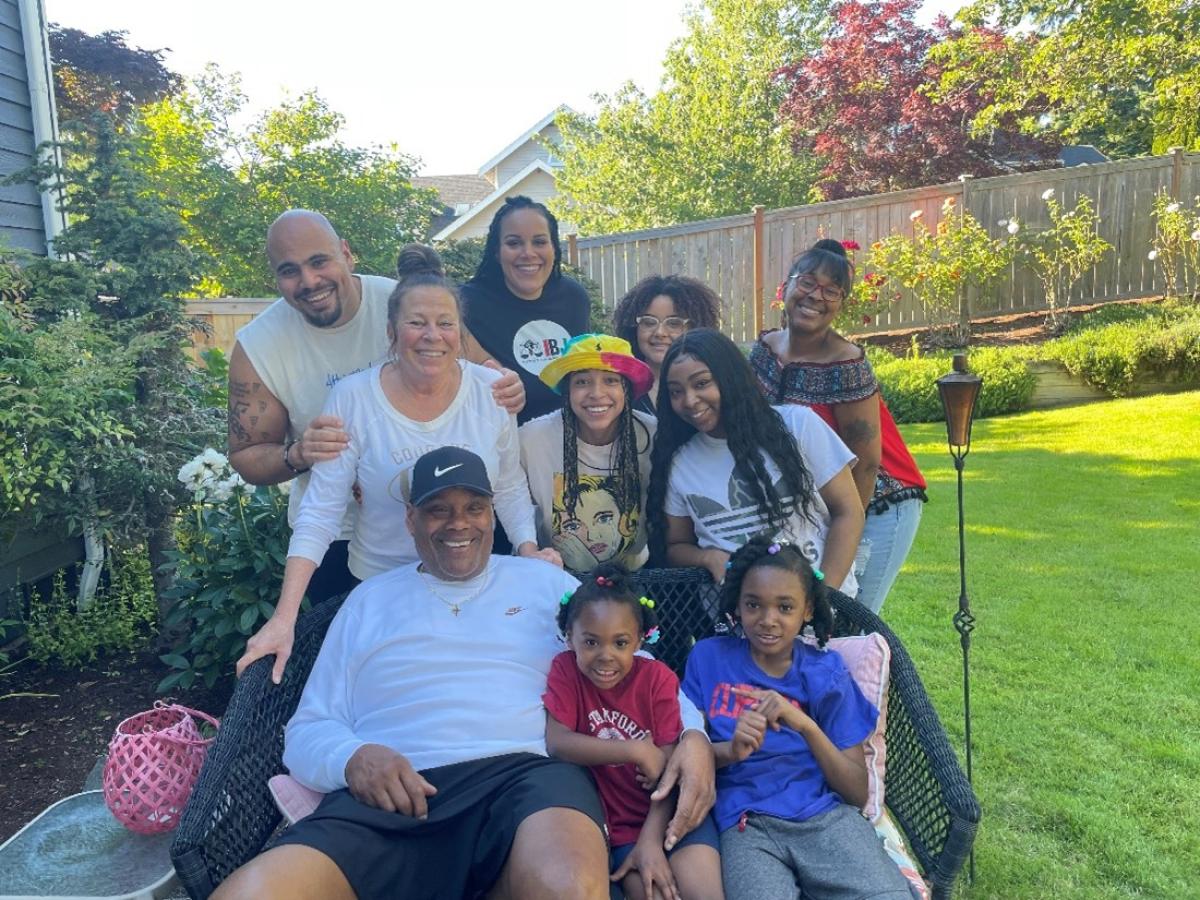 Louis Cooper Jr. surrounded by his family.