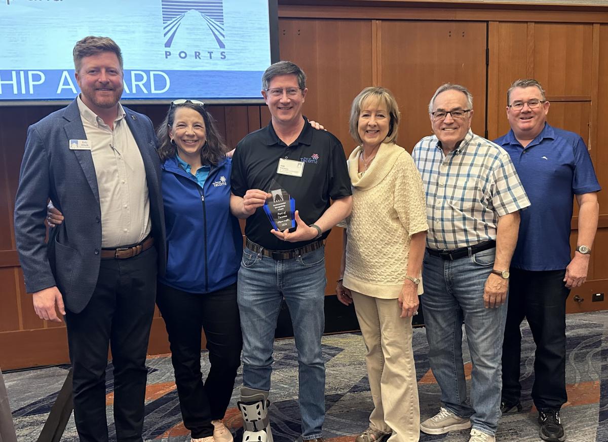 Eric ffitch, Alisa Praskovich, Rob Healy, Deanna Keller, Dick Marzano, and Eric Johnson smile at the WPPA Awards ceremony.